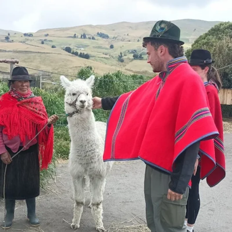 An indigenous family welcoming travelers during an authentic tour in Ecuador